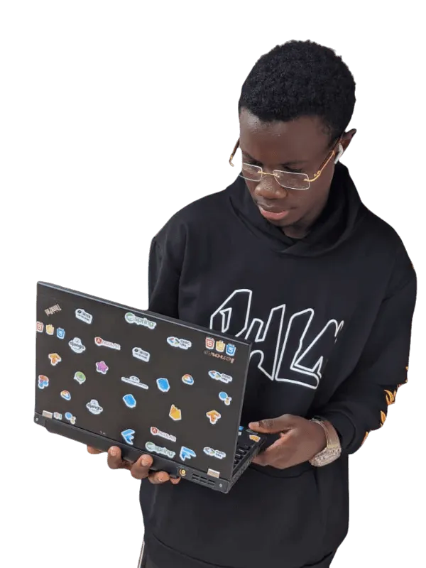 Engr. Joshua Elangwe, founder of Techknow, holding a laptop covered in developer stickers